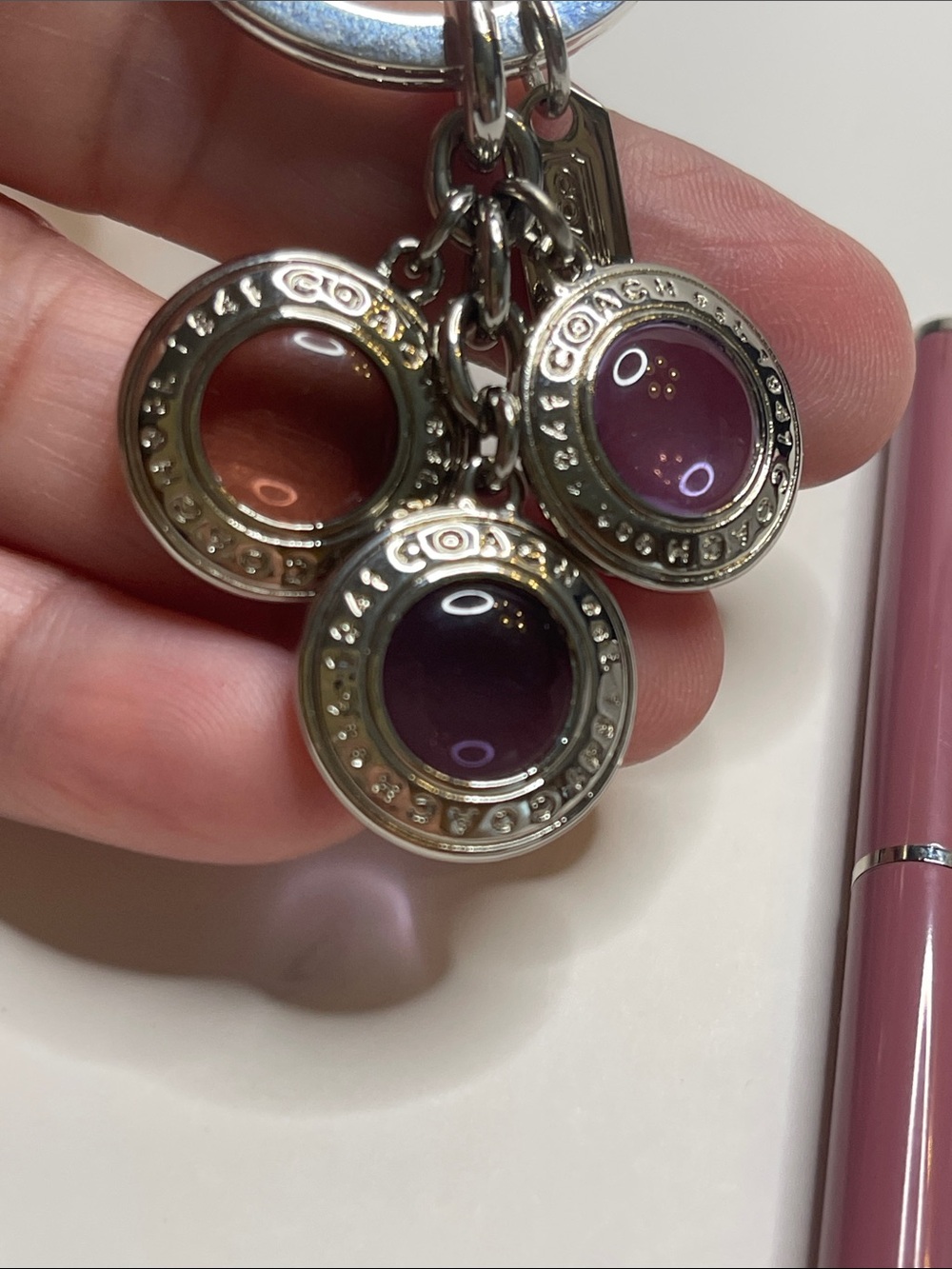 Coach Silver Circle Charm Keychain with Purple and Pink Accents and a Coach Pen - Picture 2 of 5